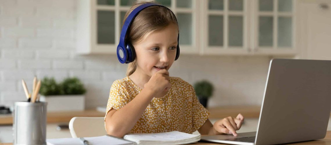 Learning,Time.,Interested,Little,Kid,Schoolgirl,In,Headset,Sit,At